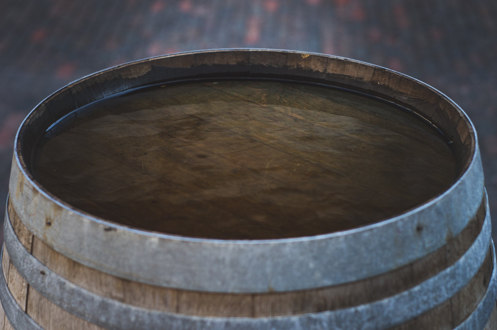 Rustic aged wood barrel top. Photo by Thomas Bradley